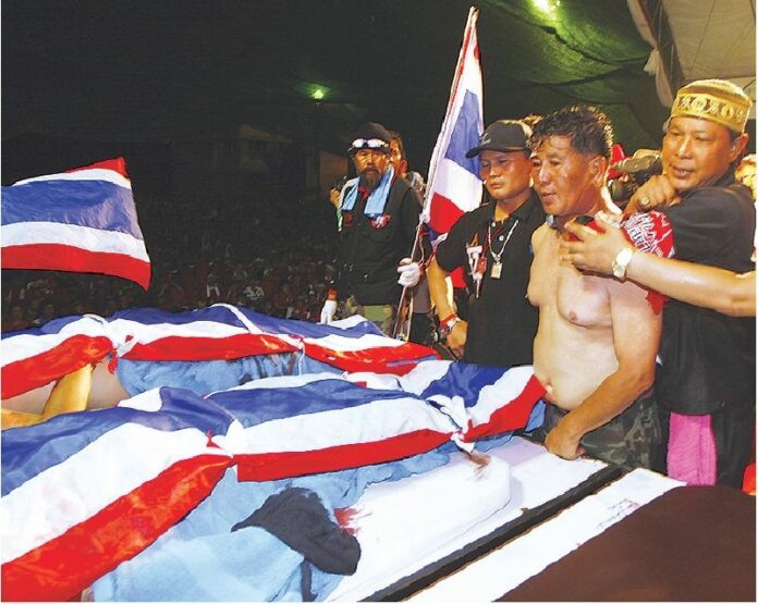 A soldier captured by the Redshirts was forced to look at the bodies of dead protesters on the Redshirt stage, just hours after the clashes on the night of 10 April 2010.