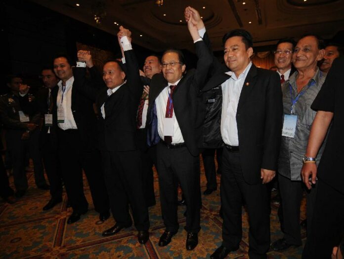 Mr. Worawi Makudi (centre) moments after he was elected Chairman of the Thai Football Association