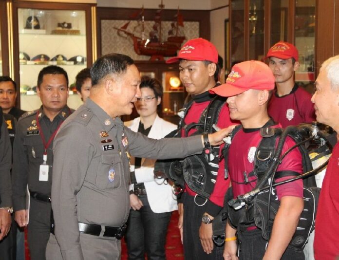 Pol.Gen. Adul Saengsingkaew briefing a group of frogmen before they departed for Laos.