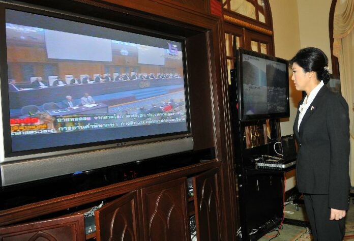PM Yingluck Shinawatra watching the live broadcast of ICJ verdict reading at Government House in Bangkok, 11 November 2013