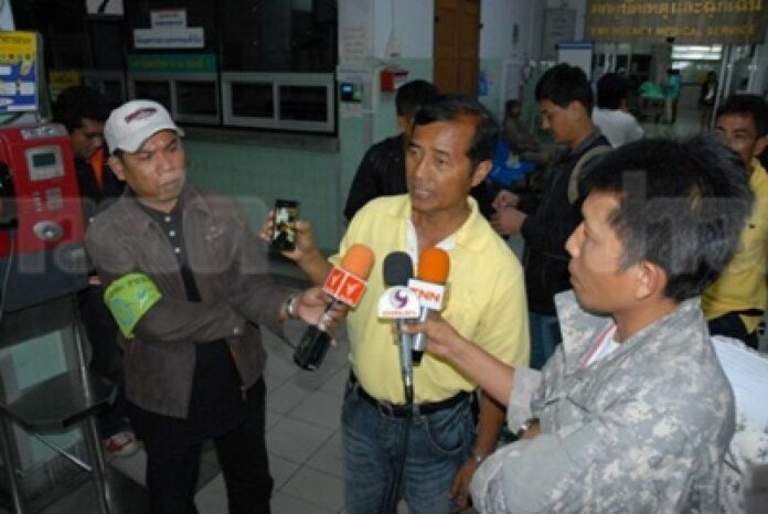 Mr. Thavorn Senniam talking to reporters