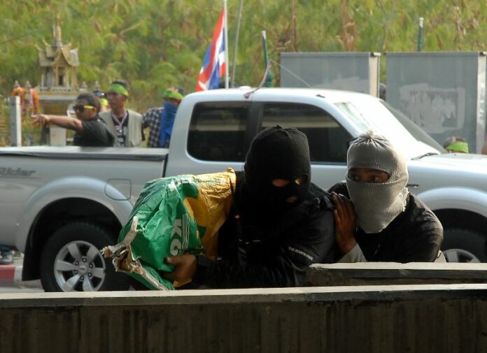 Gunmen allied to anti-government protesters during a gunbattle on 1 February 2014. Protest leaders claim they acted in self-defence against Cambodian mercenaries.