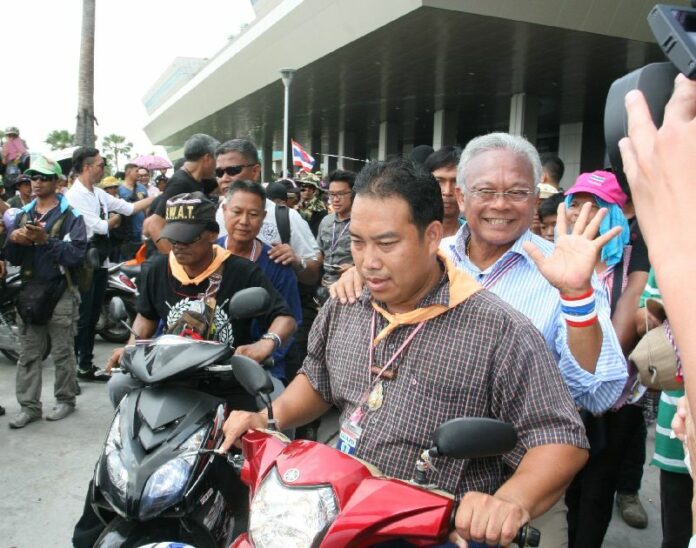 Anti-government protest leader Suthep Thaugsuban rides a motorcycle during demonstration on 1 April 2014