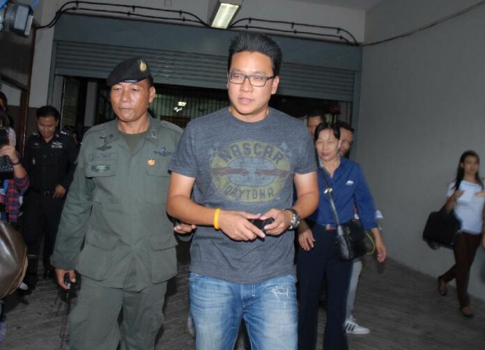 Police escort PCAD activist Sakoltee Phattiyakul after he was detained at Suvarnabhumi Airport, 27 April, 2014