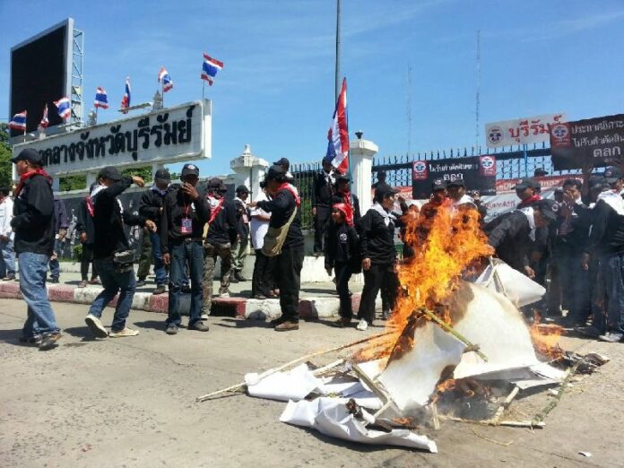 Redshirts burn a symbolic coffin in Buriram province on 9 May 2014 to protest ex-PM Yingluck's removal from office by the Constitutional Court.
