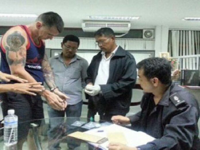 John Cohen is questioned about the shooting after his arrest in Patong (Phuketwan).<br />