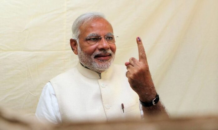 Narendra Modi, the prime ministerial candidate for India's main opposition Bharatiya Janata Party, shows his inked finger after casting his vote in Ahmadabad. Exit polls are tipping him to be in a position to form the next government (DPA).