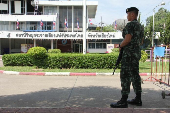 Soldier standing guard at Channel 11 in Chiang Mai Province, 20 May 2014.