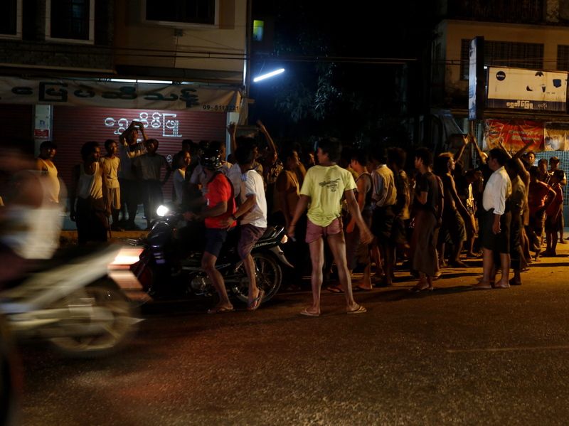Riot police try to block the protesters in Hlegu township, outskirt of Yangon earlier in April. Anti-Muslim Myanmar nationalists led by Buddhist monks launched a boycott Saturday of a Qatari firm that plans to start providing mobile phone services in August. EPA/NYEIN CHAN NAING