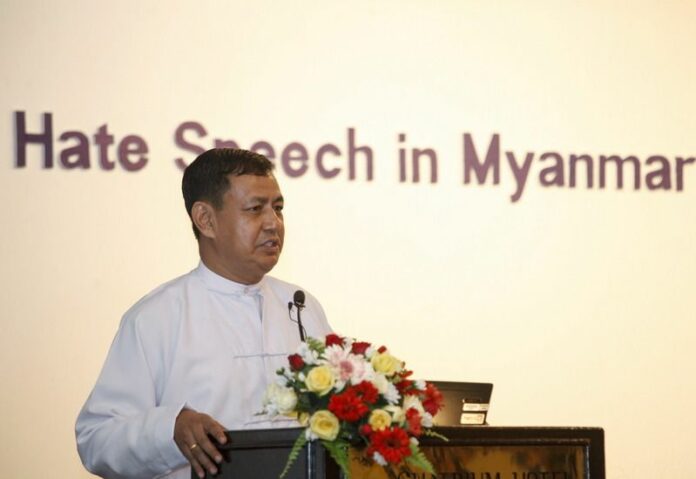 Ye Htut, spokesperson for the Myanmar president's office, shown speaking at the US Embassy in Yangon, Myanmar, 28 June 2013. Ye Htut personally apologized to opposition leader Aung San Suu Kyi on Friday for his wife's personal attack on Facebook. (DPA)