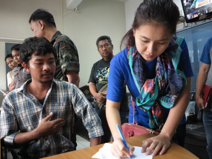 Kritsuda Khunasen signing condition of her release.
