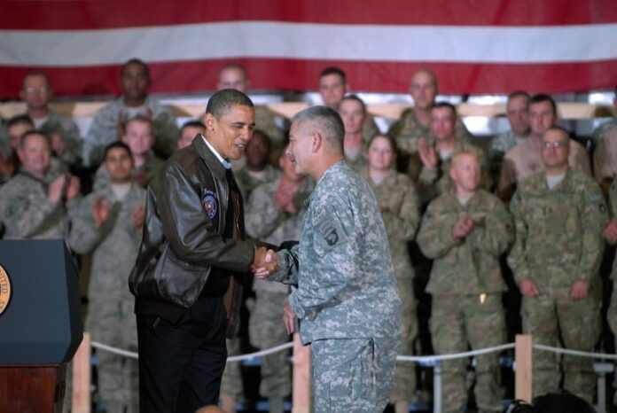 A handout photograph released by the US Department of Defense on 04 December 2010 showing Barack Obama shaking hands with U.S. Army Maj. Gen. John Campbell, commanding general of Combined Joint Task Force 101, at Bagram Airfield in Afghanistan on 03 December 2010 (DPA).
