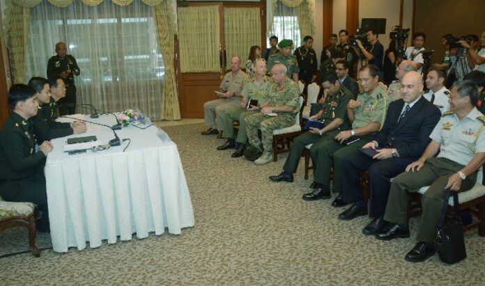 Spokespersons for the Thai military junta speak to a room of foreign military attaches, 25 June 2014.