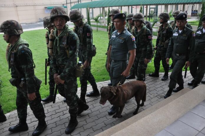 Military officers inspect a prison in Chiang Mai.