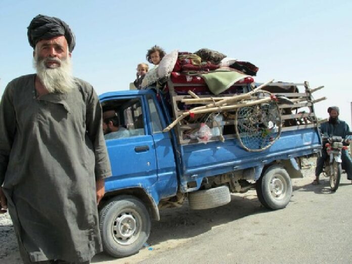 Afghan security officials check people who fled fighting between the Taliban and security forces in the southern province of Helmand as they arrive in the provincial capital, Lashkar Gah. Officials said at least 50 civilians, 30 security forces and more than 250 militants have been killed in more than a week of fighting. EPA/WATAN YAR