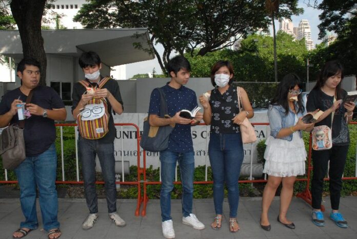 Anti-coup activists staged a brief protest in front of the US Embassy in Bangkok today to test the reaction of police who permitted an anti-American demonstration to take place at the same site on Sunday.