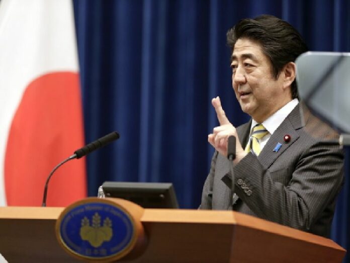 Japanese Prime Minister Shinzo Abe gestures during a televised news conference held at the prime minister's official residence in Tokyo. Abe announced Thursday that Japan is planning to ease some of its unilateral sanctions on North Korea. EPA/KIMIMASA MAYAMA<br />