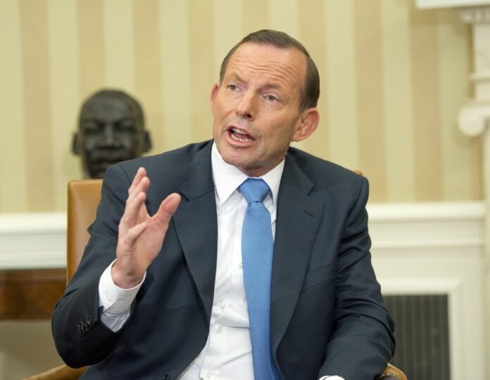 Australian Prime Minister Tony Abbott shown in a photo taken at the White House in Washington DC, 12 June 2014. Abbott praised Sri Lanka's human rights record on Thursday amid reports that Australian authorities handed Tamil asylum seekers over to the Sri Lankan navy. EPA/RON SACHS / POOL