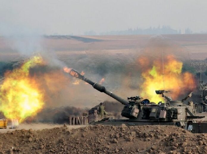 An Israeli 155mm self-propelled howitzer fires from a position at an unspecified location in southern Israeli into the Gaza Strip, on Wednesday as Israel continues to pound the area in operation Protective Edge. EPA/JIM HOLLANDER