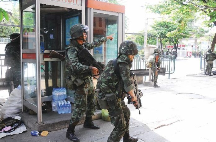 Soldiers deployed to contain Redshirt protesters on 15 May 2010.