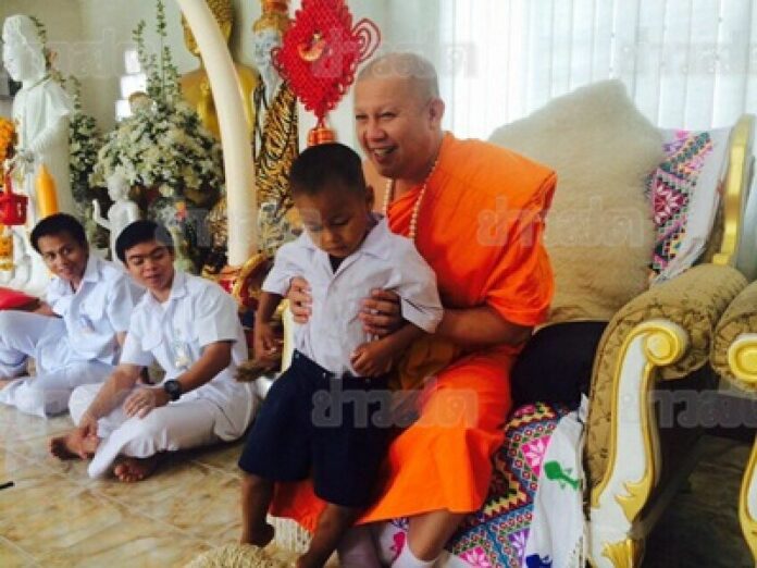 Kae Khae with Phra Ajarn Phobchoke, the abbot of Wat Huay Pla Kang in Chiang Rai province.