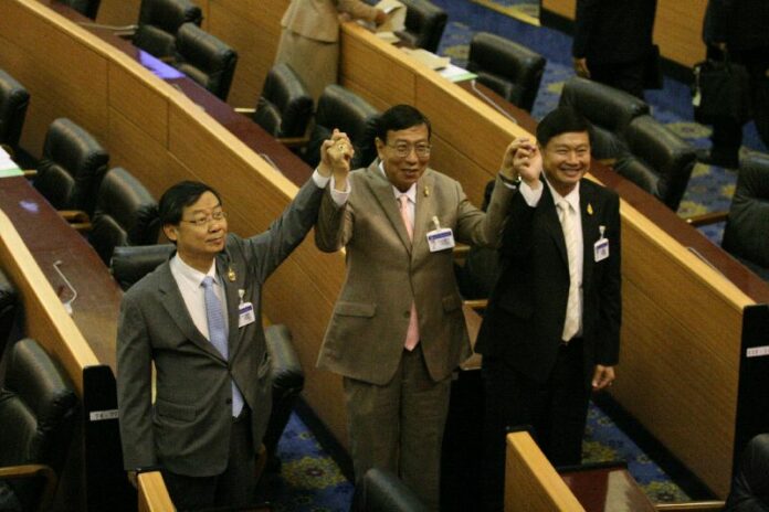 NLA members congratulate the assembly's newly-elected president, Pornpetc Wichitcholchai (centre). 8 August 2014.