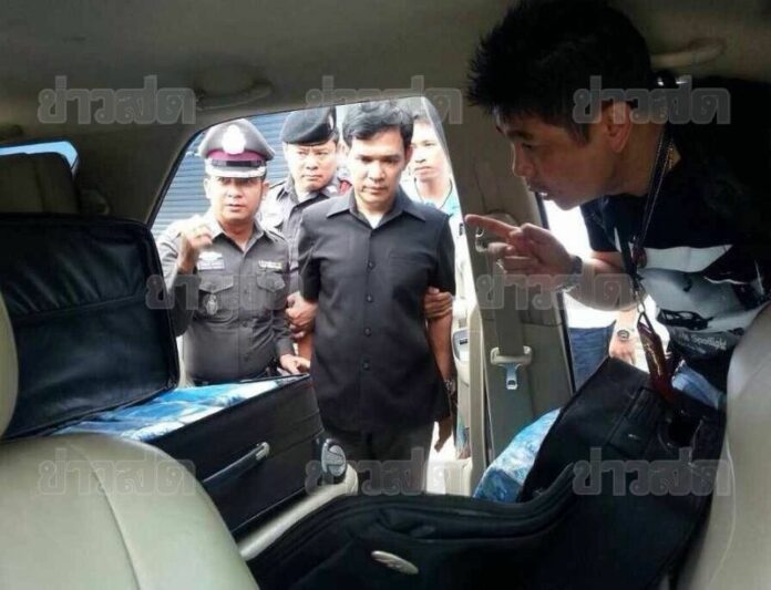 Pol.Lt.Col. Chamnarn Phoomphaichit (C) was arrested at a checkpoint near the Thai-Myanmar border in Chiang Rai province after officers searched his vehicle and found large amounts of narcotics hidden in two bags, 18 August 2014.
