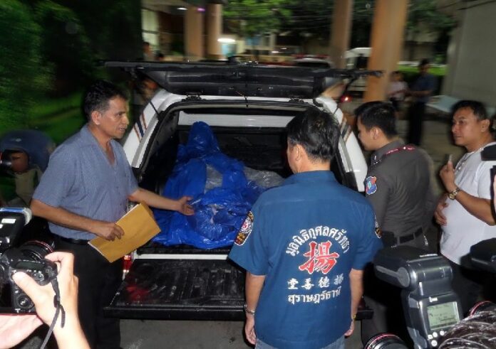 The bodies of 2 British tourists murdered on 15 September arriving in Bangkok for an autopsy, 16 Sept 2014.