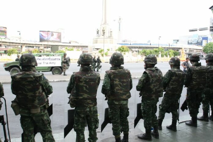 Soldiers stationed to contain anti-coup protests at Victory Monument in Bangkok, May 2014.