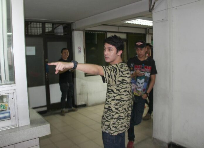 Sitthipong "Pom" Jiracharoenwong, 24, a well-known celebrity among Thailand's online gay community, at the police station on 19 Oct 2014 after testing positive for drug use.