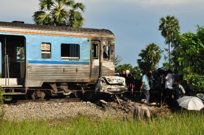A car collided into a moving train in Phetchaburi province and caused a small explosion that killed the driver and his wife, 29 Oct 2014.