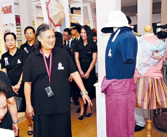 Princess Maha Chakri Sirindhorn visiting a clothing shop opposite the Grand Palace in Bangkok, 21 Nov 2013.