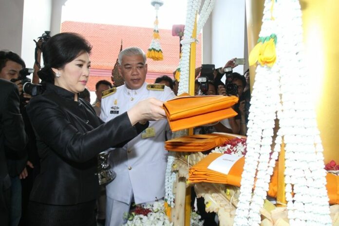 Former PM Yingluck Shinawatra at the funeral of former Pheu Thai MP Abhiwan Wiriyachai on 19 Oct 2014.<br />