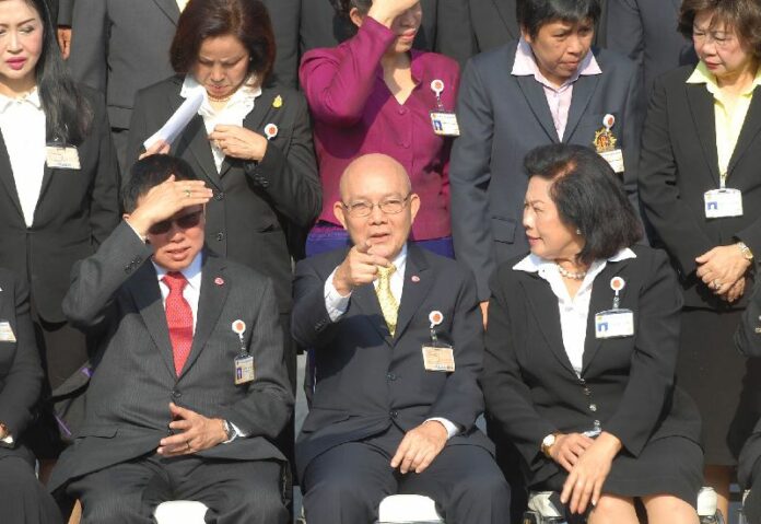 A group photo of the National Reform Council (NRC) in front of parliament on 11 Oct 2014. NRC Chairman Thienchay Kiranandana is seated in the centre. <br />