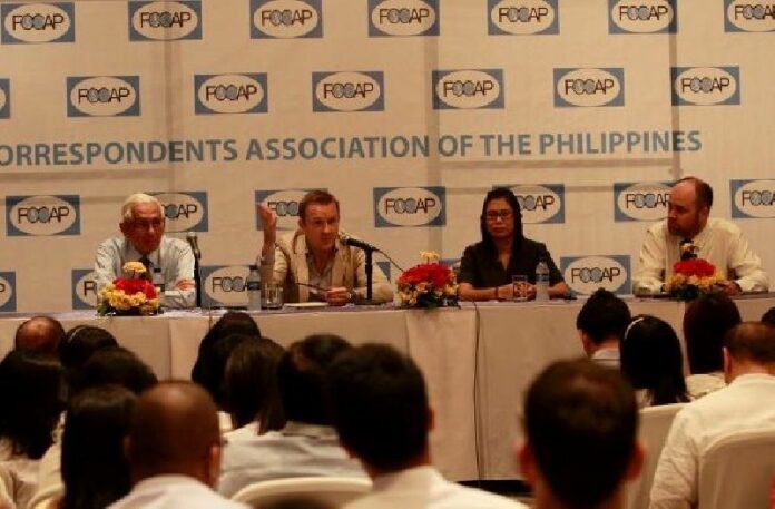 Author of " A Kingdom Crisis" Andrew M. Marshall (second from the left) speaking at a panel in the Philippines in 2011.<br />