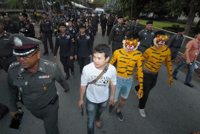 Police blocked around twenty activists, some dressed up as tigers and other wildlife, from protesting plans to build a dam in northern Thailand. Kasetsart University, Bangkok, 17 Nov 2014.