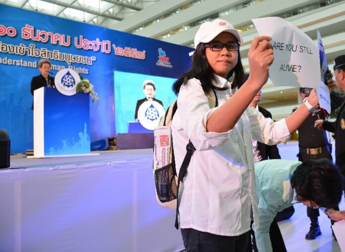 Anti-coup activists criticize National Human Rights Commission (NHRC) at an award ceremony on 12 Dec 2014.<br />
