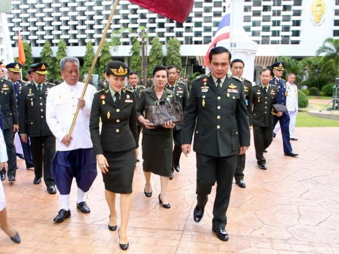 Srirasmi visiting a military academy in Bangkok, accompanied by PM Gen. Prayuth Chan-ocha, 11 September 2014