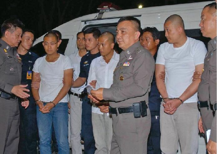 Pol.Col. Nattapong Akharaphongpreecha, now known as Nattapong Suwadee, en route to the Criminal Court in Bangkok on 27 Nov 2014.