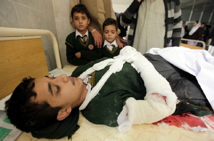 A school boy who was injured in a Taliban attack receives medical treatment at a hospital in Peshawar, Pakistan, 16 December 2014. Suspected Islamist militants stormed a school run by the military in the north-western city of Peshawar, taking hundreds of students and teachers hostage. EPA/ARSHAD ARBAB