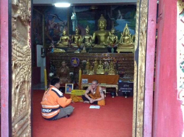 Police arrest two Russian men for allegedly breaking into a temple in a northern resort town and dressing as Buddhist monks, 14 Dec 2014.<br />