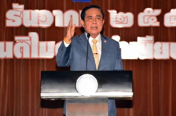 Junta leader and Prime Minister Prayuth Chan-ocha speaking at Government House on 25 December 2014. Critics of the 2014 coup fear Gen. Prayuth will not relinquish power to the new elected government.