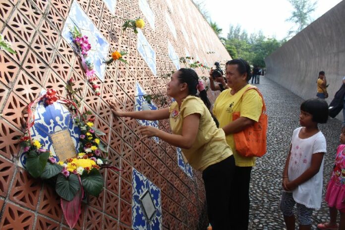 Mourners at the tsunami memorial in Phang Nga province, Thailand, 26 December 2014