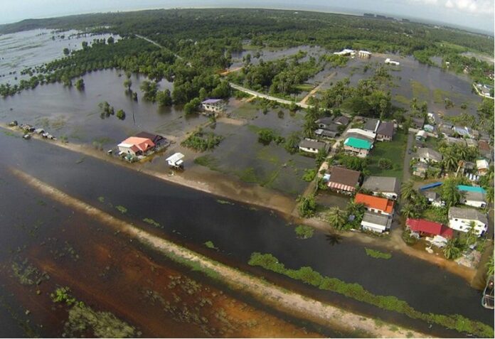 An aerial view of houses submerged by floodwaters in Pattani province, southern Thailand, 27 December 2014. EPA/STR THAILAND OUT