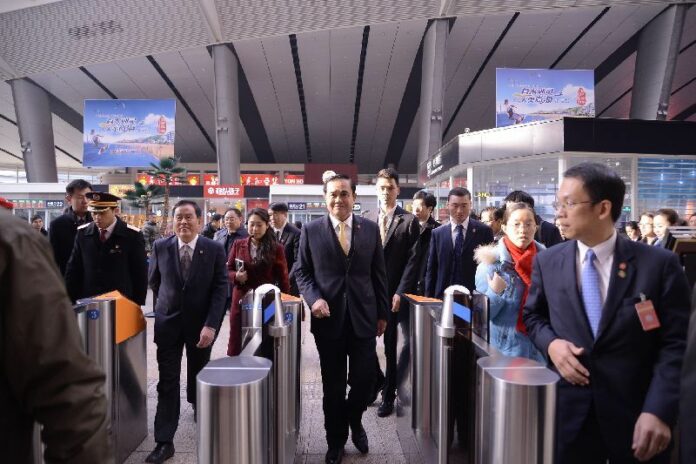Thai junta leader and Prime Minister Prayuth Chan-ocha visits a train station in Beijing, China, 23 December 2014<br />