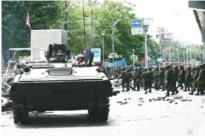 Troops clash with protesters in Bangkok on 19 May 2010, the final day of the military crackdown.