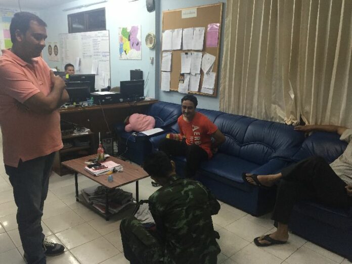 Jagtar Singh (sitting) was arrested during a police raid of a house in Banglamung district, 5 Jan 2015.
