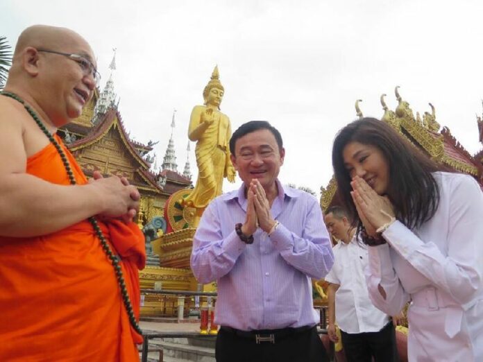 Former Prime Ministers Thaksin and Yingluck Shinawatra in southern China in November 2014.<br />