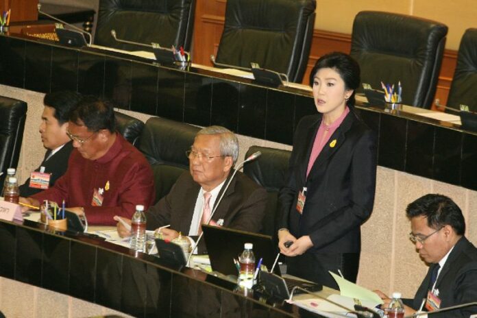 Former Prime Minister Yingluck Shinawatra defending herself against corruption allegations before the National Legislative Assembly on 9 Jan 2015.<br />