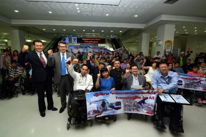 Commuters with disabilities who filed suit against City Hall over access to the BTS Skyrtrain gather to hear the verdict at the Supreme Administrative Court, 21 January 2015